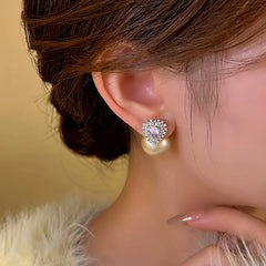 Close-up detail of the sparkling zircons and plating on the Pink Heart Pearl Earrings