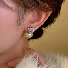 Angled view of the 14K Gold-Plated Elegant Pink Diamond Heart Pearl Earrings