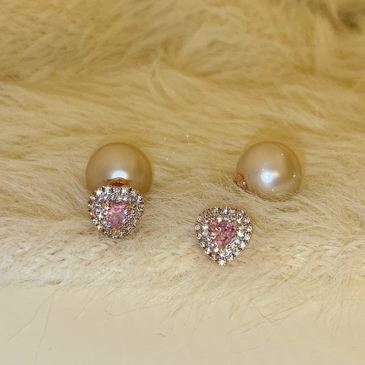Model showcasing the dangle and style of the 14K Gold-Plated Elegant Pink Diamond Heart Pearl Earrings