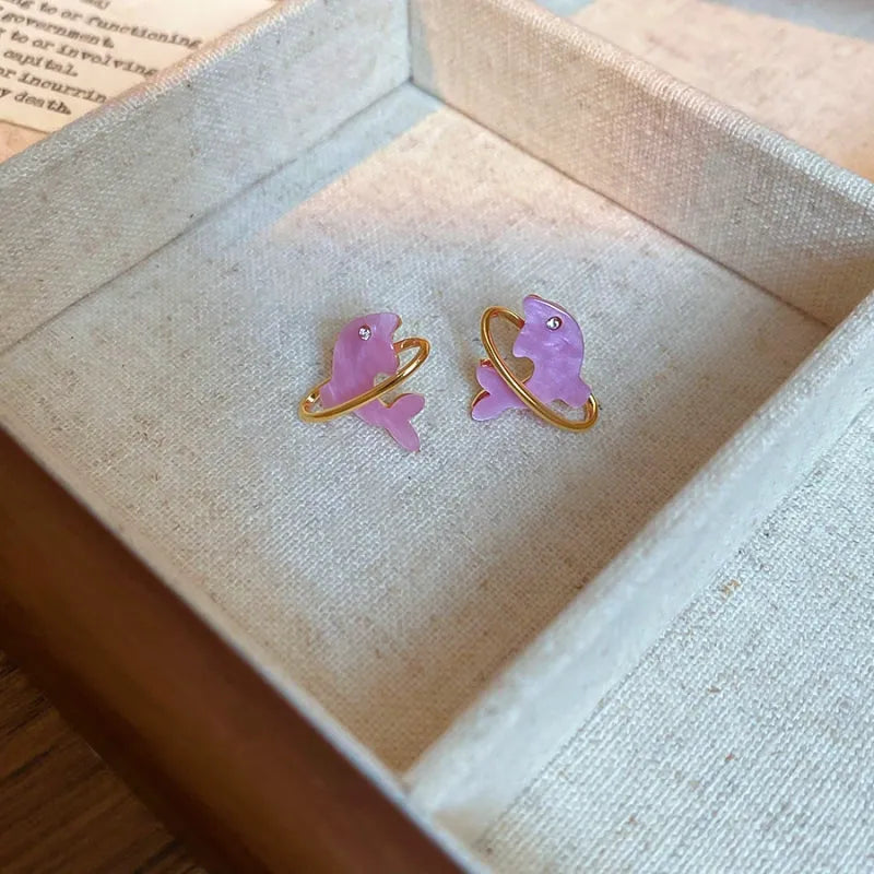 Angled view of the 14K Gold-Plated Elegant Pink Dolpin Stud Earrings