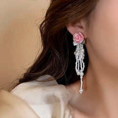 Close-up detail of the sparkling zircons and plating on the Pink Rose Tassel Earrings
