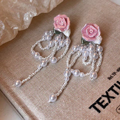 Angled view of the 14K Gold-Plated Elegant Pink Rose Bead Tassel Earrings