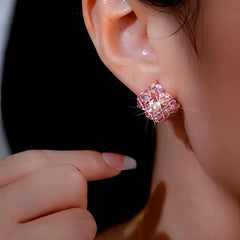 Model showcasing the dangle and style of the 14K Gold-Plated Elegant Pink Zircon Celebrity Style Studs