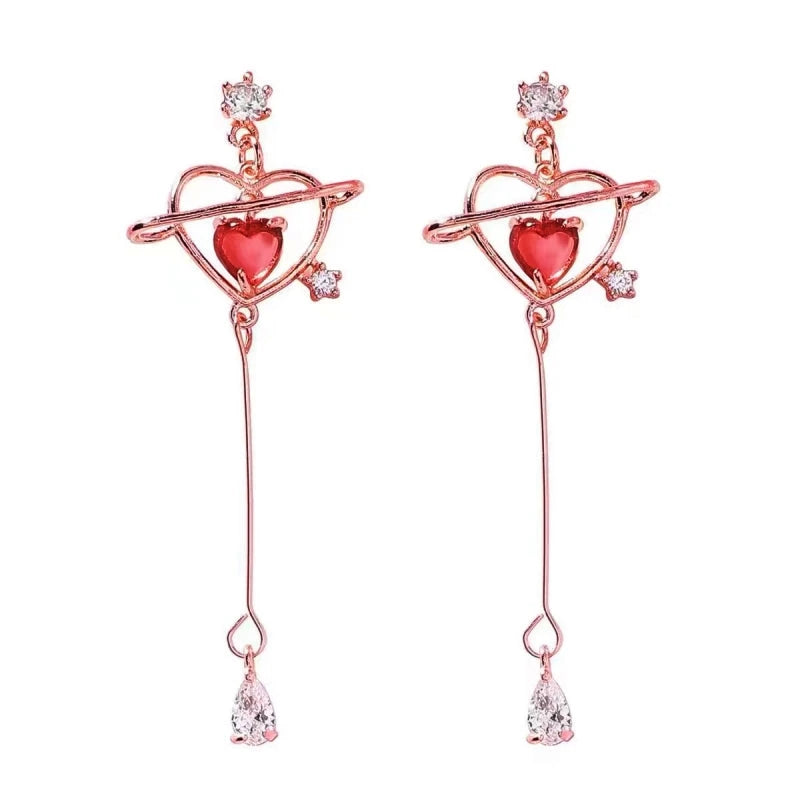 Angled view of the 14K Gold-Plated Elegant Pink Zircon Diamond Heart Tassel Earrings