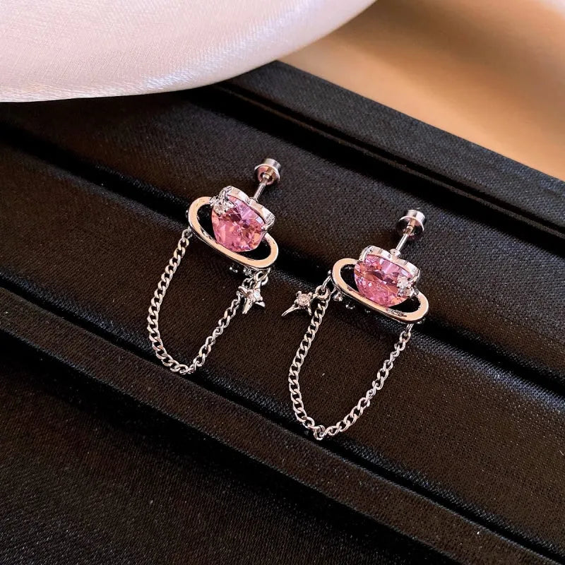 Angled view of the 14K Gold-Plated Elegant Pink Zircon Heart Tassel Earrings