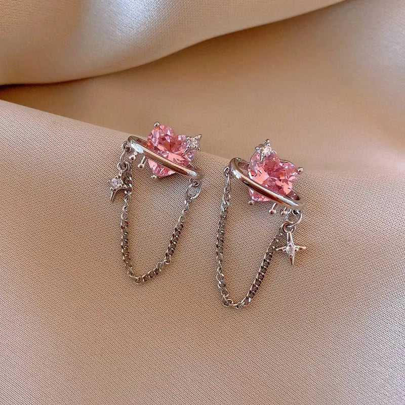 Model showcasing the dangle and style of the 14K Gold-Plated Elegant Pink Zircon Heart Tassel Earrings