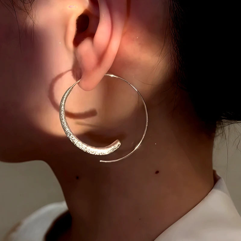 Model showcasing the dangle and style of the 14K Gold-Plated Elegant Plain Hoop Threader Earrings