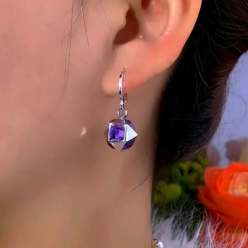 Close-up detail of the sparkling zircons and plating on the Purple Cube Earrings