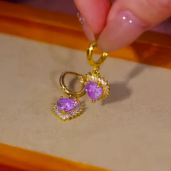 Close-up detail of the sparkling zircons and plating on the Purple Diamond Heart Earrings