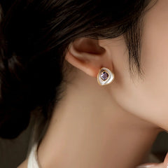 Close-up detail of the sparkling zircons and plating on the Purple Diamond Studs