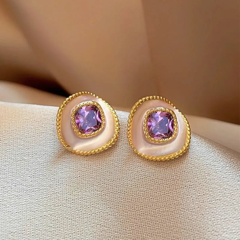 Angled view of the 14K Gold-Plated Elegant Purple Diamond Stud Earrings