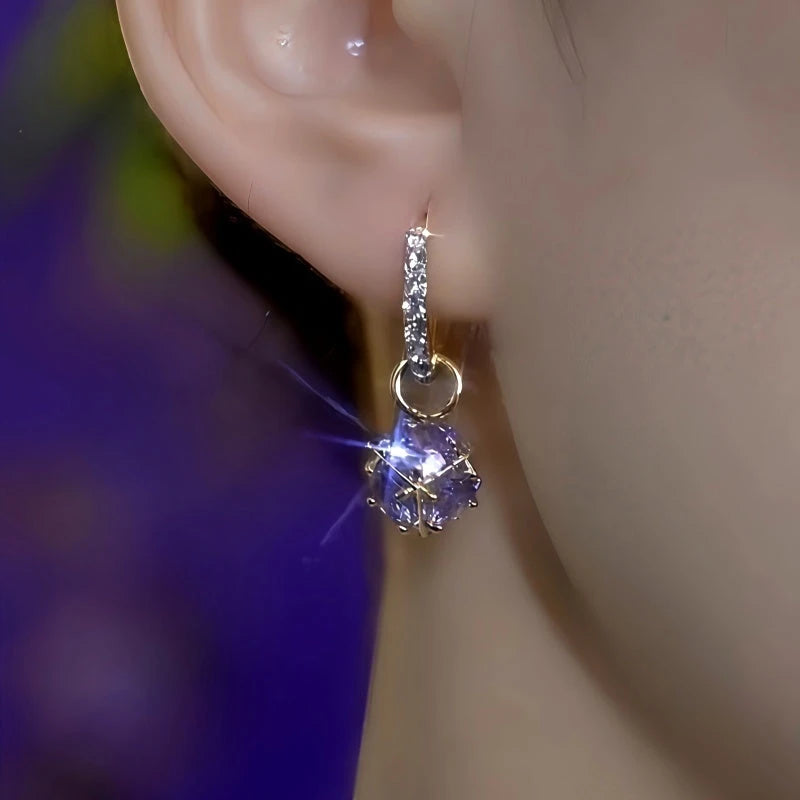 Model showcasing the dangle and style of the 14K Gold-Plated Elegant Purple Diamond Water Drop Earrings