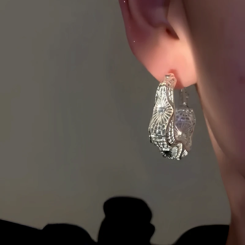 Close-up detail of the sparkling zircons and plating on the Purple Hollow Hoops