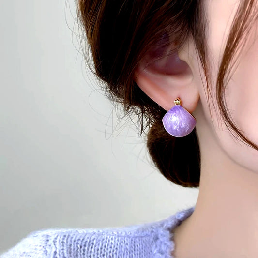 Model showcasing the dangle and style of the 14K Gold-Plated Elegant Purple Oil Drop Basket Earrings