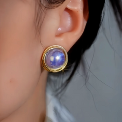 Close-up detail of the sparkling zircons and plating on the Purple Pearl Studs