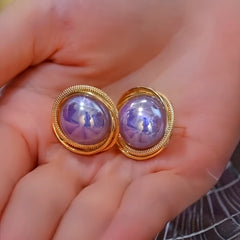 Angled view of the 14K Gold-Plated Elegant Purple Pearl Stud Earrings