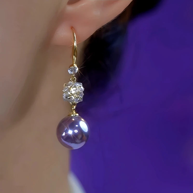 Close-up detail of the sparkling zircons and plating on the Purple Pearl Zircon Earrings