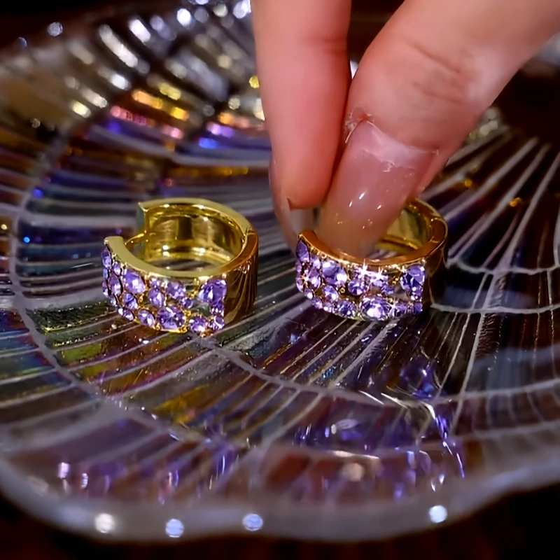 Angled view of the 14K Gold-Plated Elegant Purple Zircon DIamond Hoop Earrings