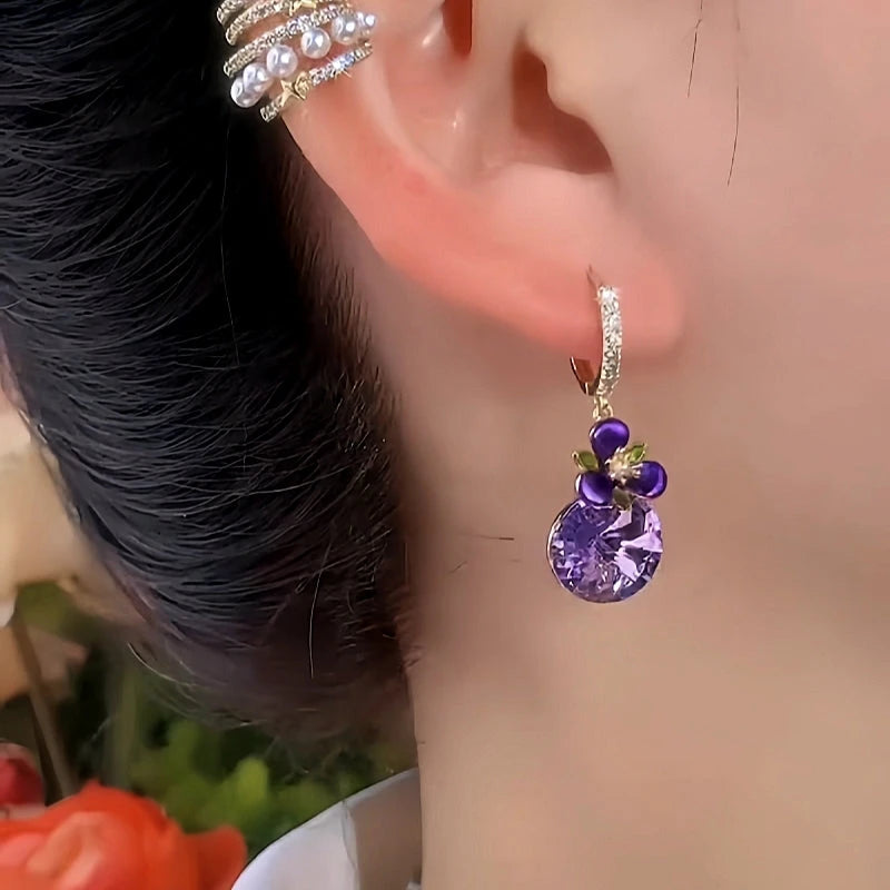 Close-up detail of the sparkling zircons and plating on the Purple Zircon Flower Earrings