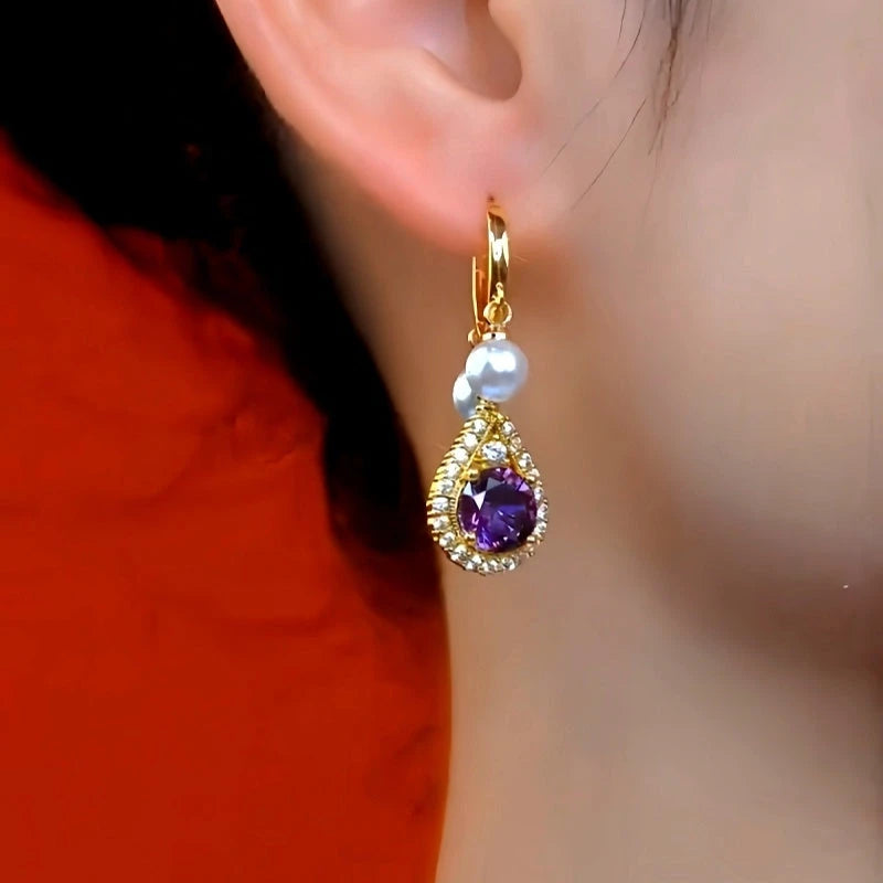 Close-up detail of the sparkling zircons and plating on the Purple Pearl Tassel Earrings