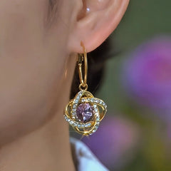 Close-up detail of the sparkling zircons and plating on the Purple Zircon Earrings