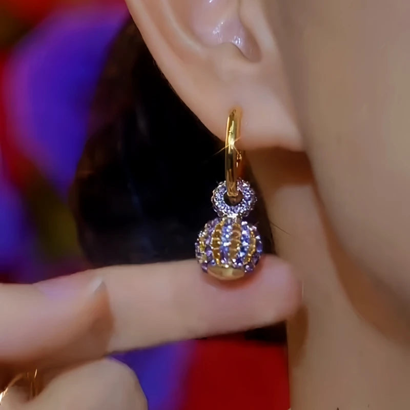 Close-up detail of the sparkling zircons and plating on the Purple Zircon Earrings