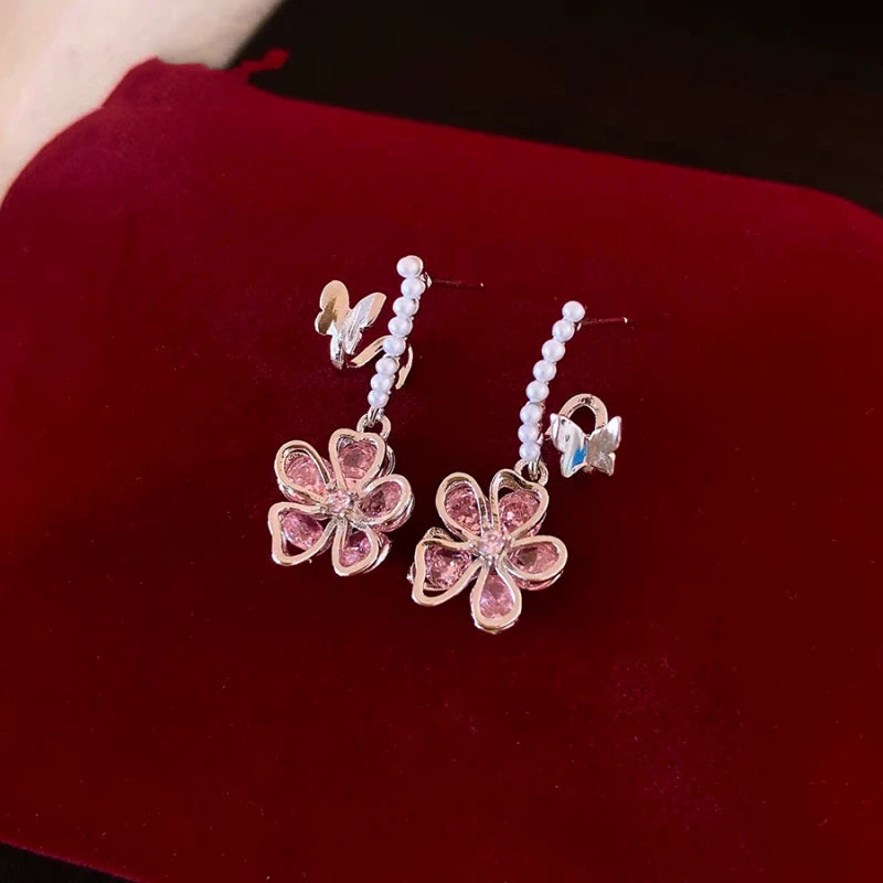 Angled view of the 14K Gold-Plated Elegant Purple Zircon Flower Butterfly Earrings