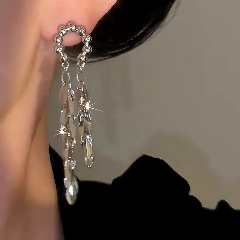 Close-up detail of the sparkling zircons and plating on the Willow Tassel Earrings