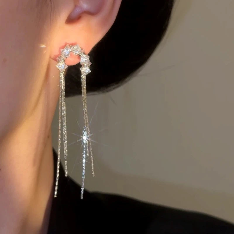 Model showcasing the dangle and style of the 14K Gold-Plated Elegant Real Willow Tassel Earrings