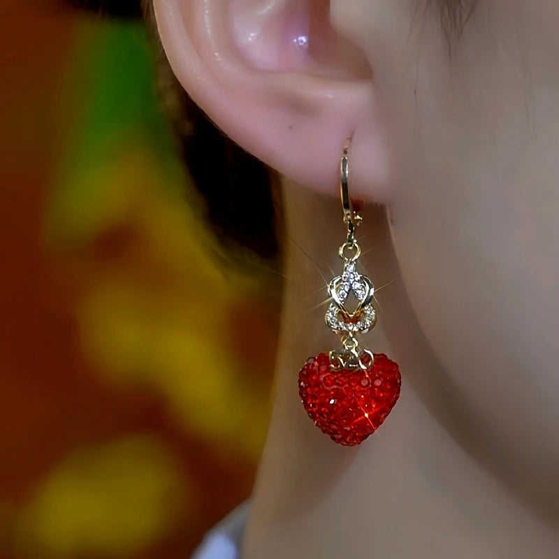 Close-up detail of the sparkling zircons and plating on the Red Diamond Heart Earrings