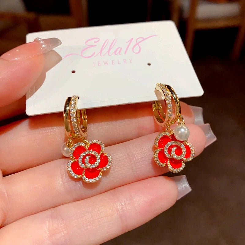 Angled view of the 14K Gold-Plated Elegant Red Oil Drop Flower Pearl Earrings