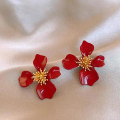 Close-up detail of the sparkling zircons and plating on the Red Flower Earrings