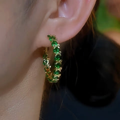 Model showcasing the dangle and style of the 14K Gold-Plated Elegant Rhinestone Bow Hoop Earrings