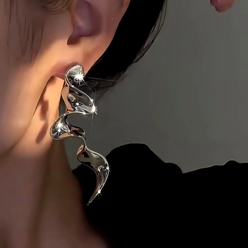 Model showcasing the dangle and style of the 14K Gold-Plated Elegant Ribbon Tassel Earrings