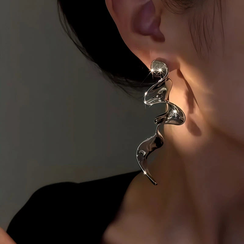 Close-up detail of the sparkling zircons and plating on the Ribbon Tassel Earrings