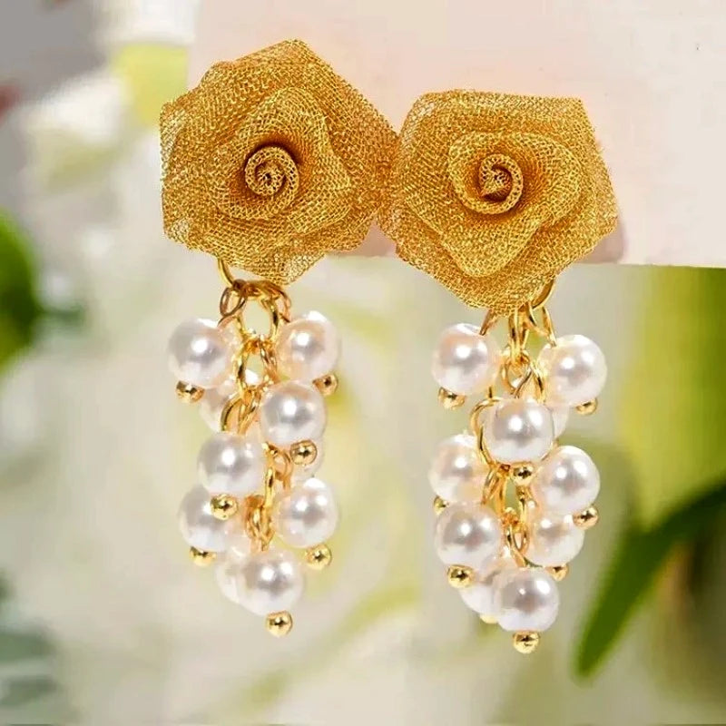 Angled view of the 14K Gold-Plated Elegant Rose Bead Tassel Earrings