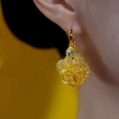 Model showcasing the dangle and style of the 14K Gold-Plated Elegant Rose Flower Tassel Earrings