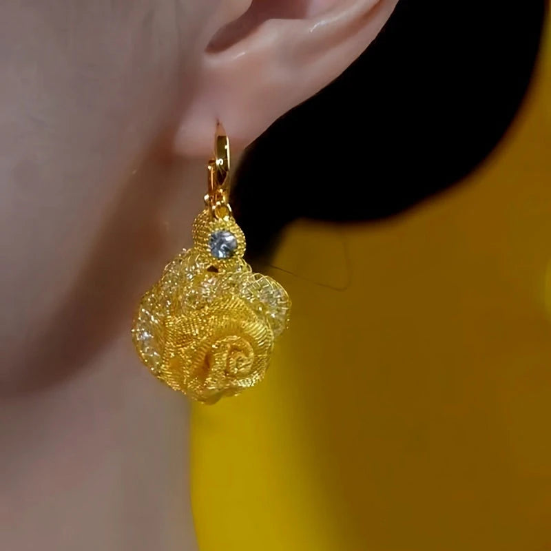 Close-up detail of the sparkling zircons and plating on the Rose Tassel Earrings