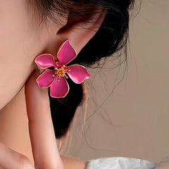 Close-up detail of the sparkling zircons and plating on the Pink Flower Studs