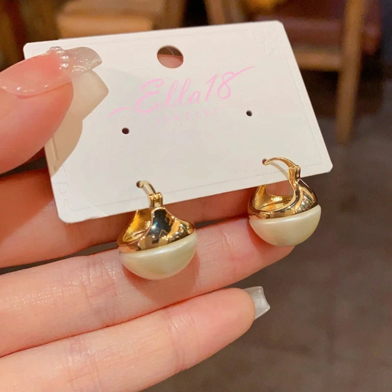 Angled view of the 14K Gold-Plated Elegant Round Pearl Earrings