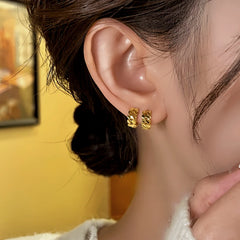 Close-up detail of the sparkling zircons and plating on the Sequin Hoop Earrings