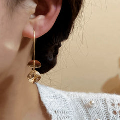 Model showcasing the dangle and style of the 14K Gold-Plated Elegant Sequined Long Threader Earrings