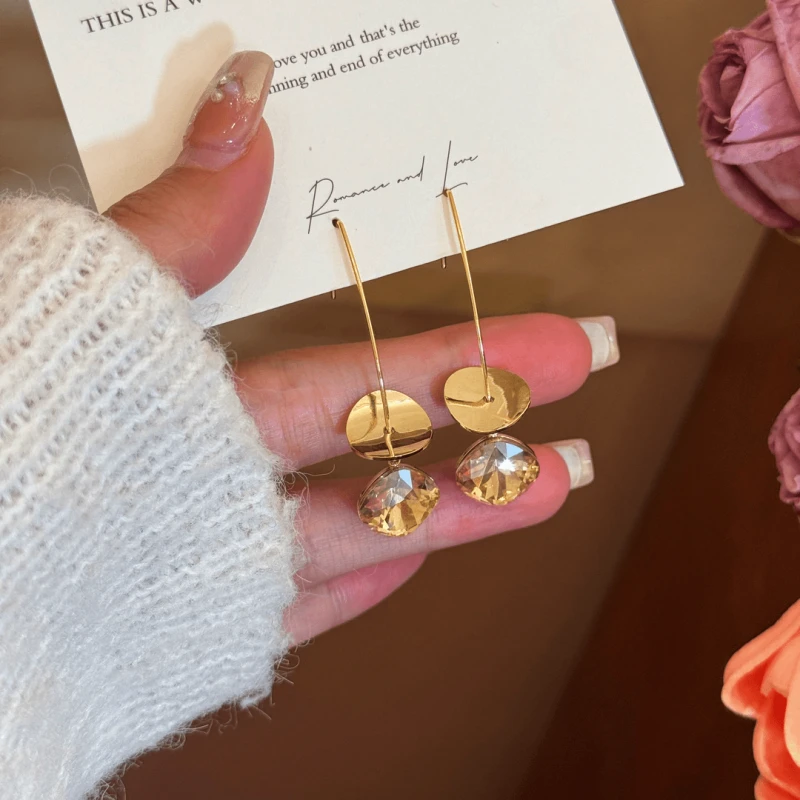 Angled view of the 14K Gold-Plated Elegant Sequined Long Threader Earrings