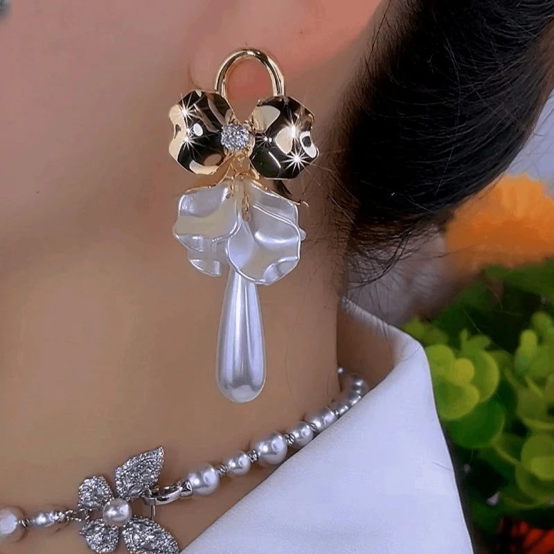 Close-up detail of the sparkling zircons and plating on the Shell Flower Earrings