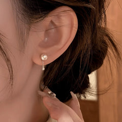 Close-up detail of the sparkling zircons and plating on the Chain Pearl Earrings