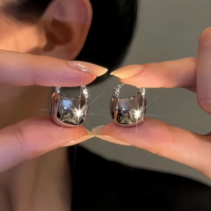 Angled view of the 14K Gold-Plated Elegant Silver Bag Earrings