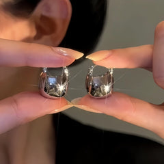 Angled view of the 14K Gold-Plated Elegant Silver Bag Earrings