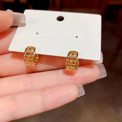 Close-up detail of the sparkling zircons and plating on the Small Hoop Earrings