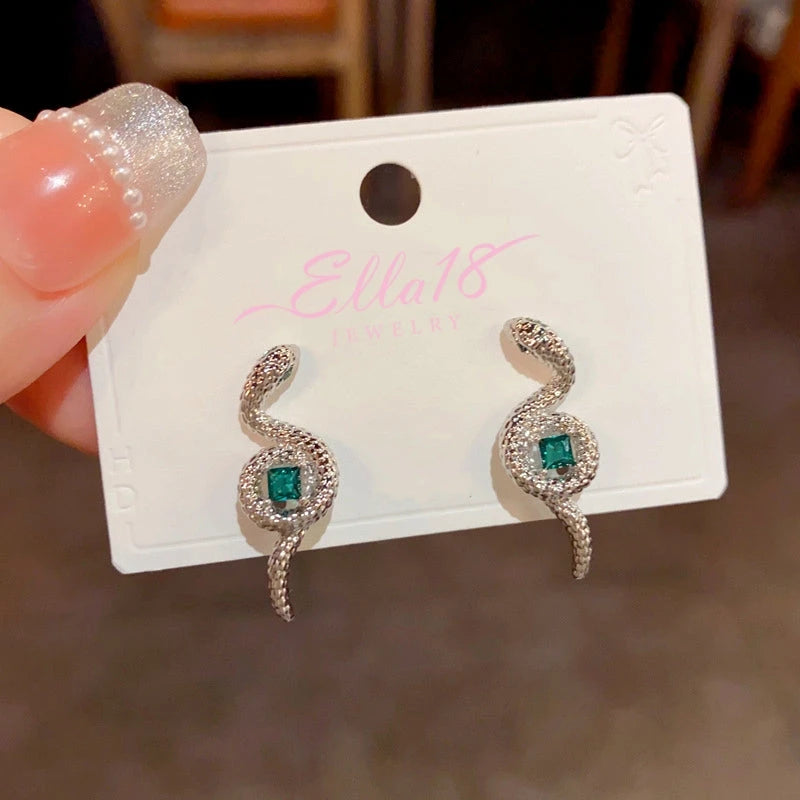 Angled view of the 14K Gold-Plated Elegant Snake-Shaped Green Square Diamond Earrings