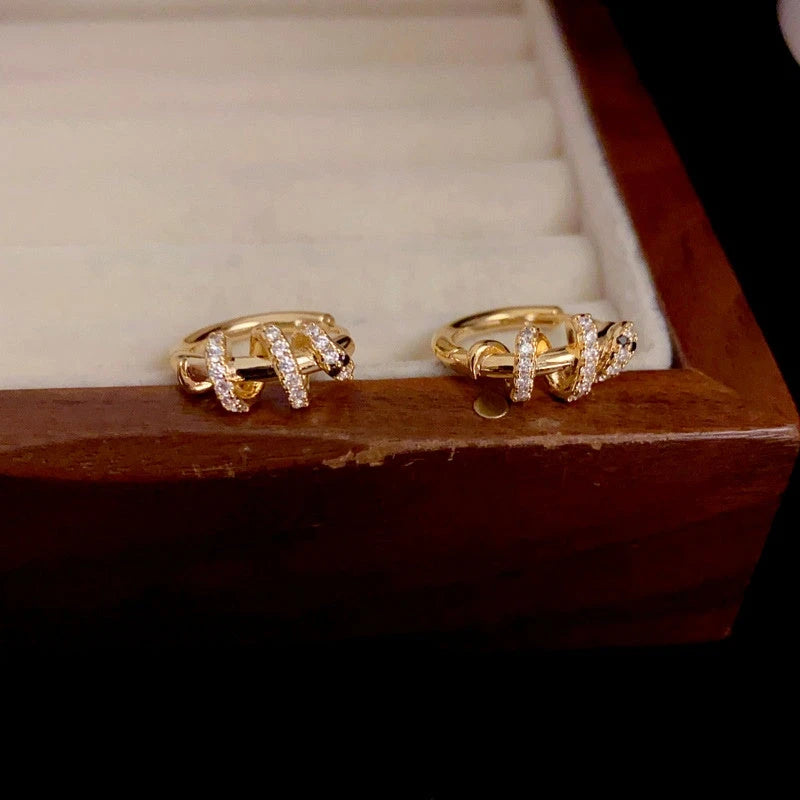 Angled view of the 14K Gold-Plated Elegant Snake Design Hoop Earrings